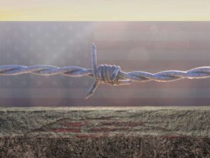 Reinforced concrete border wall with barbed wire, superimposed over a U.S. flag backdrop, symbolizing security and immigration enforcement